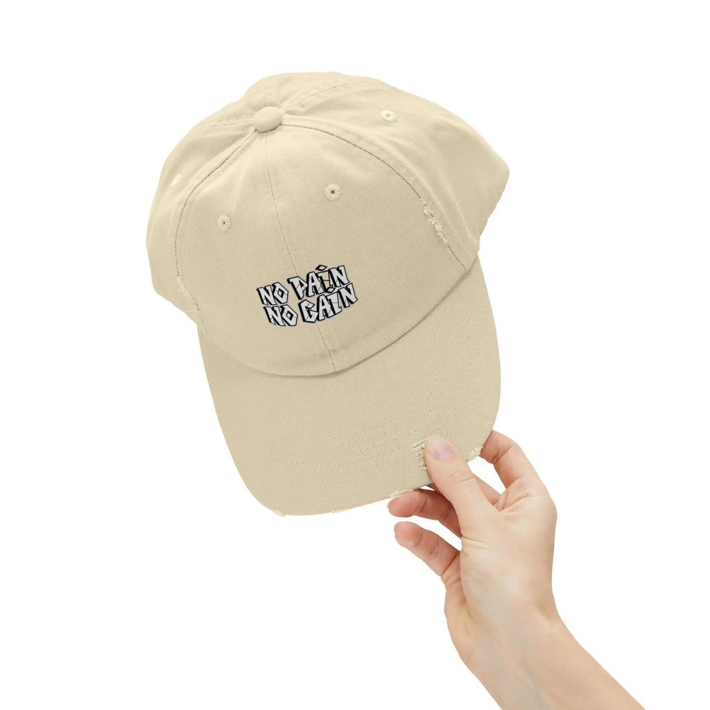 Beige MY$TOAR cap with 'NO PAIN NO GAIN' text, held by hand, luxury apparel accessory