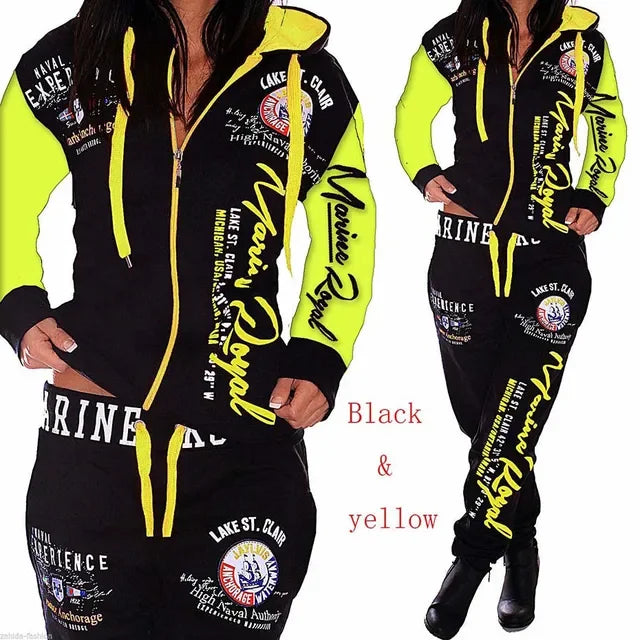 Black and yellow luxury hoodie and jogger set with bold graphic text and patches, MY$TOAR apparel.